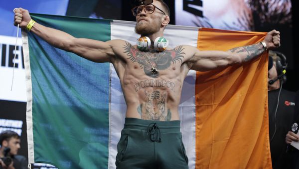 Conor McGregor stands on stage during a weigh-in Friday, Aug. 25, 2017, in Las Vegas. - Sputnik International