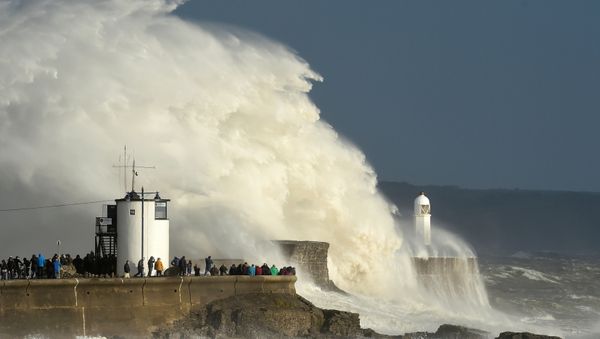 Waves crash over the lighthouse as storm Ophelia passes Porthcawl, Wales, Britain, October 16, 2017. Waves crash over the lighthouse as storm Ophelia passes Porthcawl, Wales, Britain, October 16, 2017. - Sputnik International
