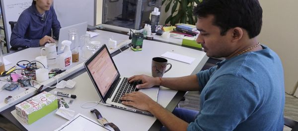 In this Thursday, June 30, 2016 photo, Babson College graduate school alumnus Abhinav Sureka, of Mumbai, India, right, types in his work space at the college in Wellesley, Mass. - Sputnik International