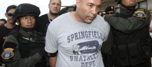 Joseph Manuel Hunter, center, is escorted by Thai police commandos to Police Aviation Division after being arrested, in Bangkok, Thailand, Thursday, Sept. 26, 2013. Joseph Manuel Hunter, center, is escorted by Thai police commandos to Police Aviation Division after being arrested, in Bangkok, Thailand, Thursday, Sept. 26, 2013. - Sputnik International