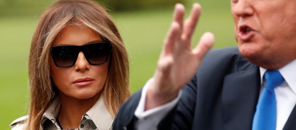 First Lady Melania Trump looks on as US President Donald Trump speaks to reporters upon his departure from the White House in Washington, US, October 13, 2017. First Lady Melania Trump looks on as US President Donald Trump speaks to reporters upon his departure from the White House in Washington, US, October 13, 2017. - Sputnik International