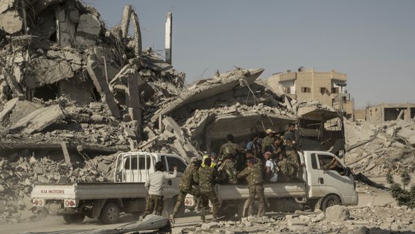 Members of the U.S.-backed Syrian Democratic Forces (SDF) ride near near the main traffic circle in Raqqa Syria, Friday, Oct. 20, 2017 Members of the U.S.-backed Syrian Democratic Forces (SDF) ride near near the main traffic circle in Raqqa Syria, Friday, Oct. 20, 2017 - Sputnik International