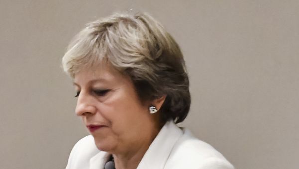 British Prime Minister Theresa May waits for the arrival of European Council President Donald Tusk prior to a bilateral meeting with European Council President Donald Tusk during an EU summit in Brussels on Friday, Oct. 20, 2017 - Sputnik International
