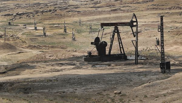 This July 30, 2017 photo, shows an oil field controlled by the Kurdish-led Syrian Democratic Forces (SDF), in Rmeilan, Hassakeh province, northeast Syria. - Sputnik International