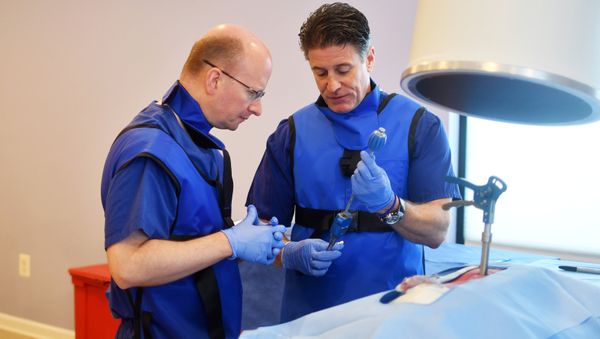 Drew Gaworski, an instructor for medical device maker Vertiflex, uses a donated human spine to teach Dr. Richard Stayner, (L), how to implant a device during a seminar in Sterling, Virginia, U.S. September 9, 2017. Picture taken September 9, 2017 Drew Gaworski, an instructor for medical device maker Vertiflex, uses a donated human spine to teach Dr. Richard Stayner, (L), how to implant a device during a seminar in Sterling, Virginia, U.S. September 9, 2017. Picture taken September 9, 2017 - Sputnik International