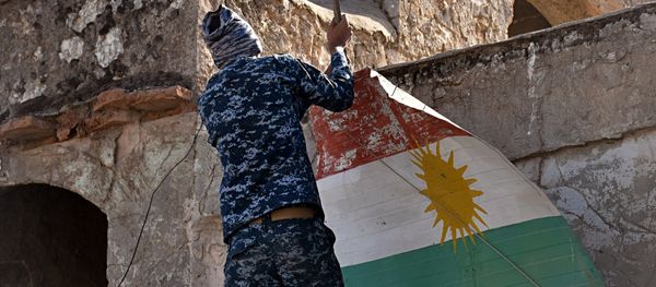 An Iraqi soldier removes a Kurdish flag from Altun Kupri on the outskirts of Irbil, Iraq, Friday Oct. 20, 2017 An Iraqi soldier removes a Kurdish flag from Altun Kupri on the outskirts of Irbil, Iraq, Friday Oct. 20, 2017 - Sputnik International