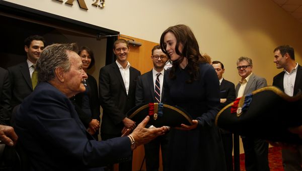 Former President George H.W. Bush, left, receives a tri-corner hat from actress Heather Lind, right, at a private screening of AMC's new series TURN in Houston, Texas. (File) Former President George H.W. Bush, left, receives a tri-corner hat from actress Heather Lind, right, at a private screening of AMC's new series TURN in Houston, Texas. (File) - Sputnik International