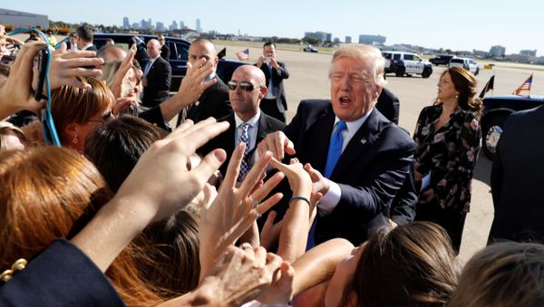 U.S. President Donald Trump greets well wishers upon his arrival at Dallas Love Field in Dallas, Texas, U.S, October 25, 2017 U.S. President Donald Trump greets well wishers upon his arrival at Dallas Love Field in Dallas, Texas, U.S, October 25, 2017 - Sputnik International