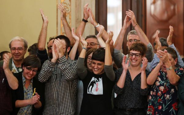 Leftist CUP party members applaud during a ceremony after the Catalan regional parliament declared independence from Spain in Barcelona, Spain Leftist CUP party members applaud during a ceremony after the Catalan regional parliament declared independence from Spain in Barcelona, Spain - Sputnik International