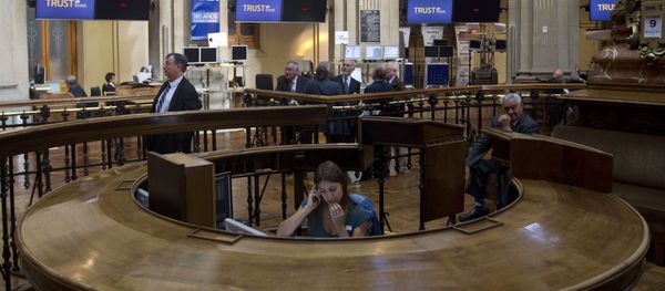A worker speaks on a cell phone at the Stock Exchange in Madrid A worker speaks on a cell phone at the Stock Exchange in Madrid - Sputnik International