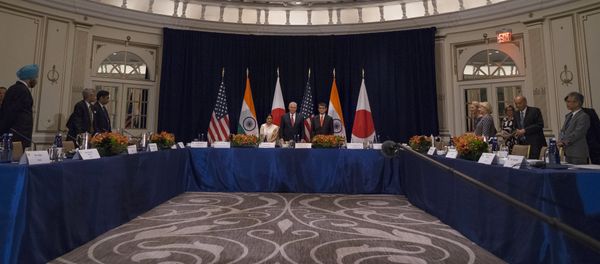 U.S. Secretary of State Rex Tillerson, center at center table, stands with Indian External Affairs Minister Sushma Swaraj, left, and Japanese Foreign Minister Taro Kono, at the Palace Hotel during a meeting in New York, Monday, Sept. 18, 2017 U.S. Secretary of State Rex Tillerson, center at center table, stands with Indian External Affairs Minister Sushma Swaraj, left, and Japanese Foreign Minister Taro Kono, at the Palace Hotel during a meeting in New York, Monday, Sept. 18, 2017 - Sputnik International