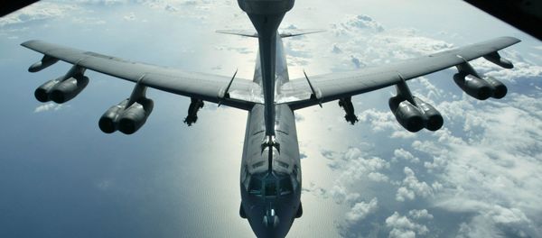 A US Air Force B-52 bomber returning from a mission over Iraq is refueling from a KC-10 plane over the Black Sea, in this Friday, March 28, 2003 photo A US Air Force B-52 bomber returning from a mission over Iraq is refueling from a KC-10 plane over the Black Sea, in this Friday, March 28, 2003 photo - Sputnik International