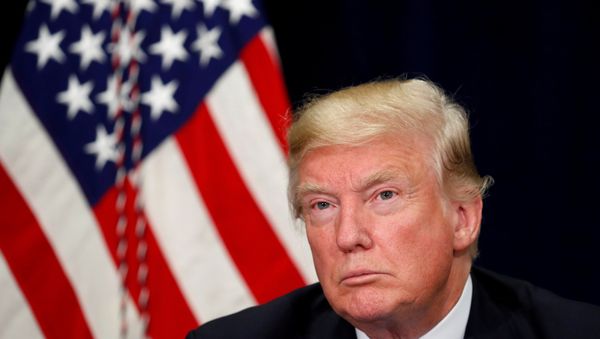 US President Donald Trump listens during a briefing on hurricane Harvey recovery efforts in Dallas, Texas, US, October 25, 2017. - Sputnik International