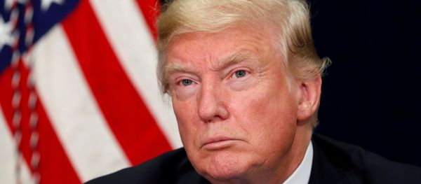 US President Donald Trump listens during a briefing on hurricane Harvey recovery efforts in Dallas, Texas, US, October 25, 2017. - Sputnik International