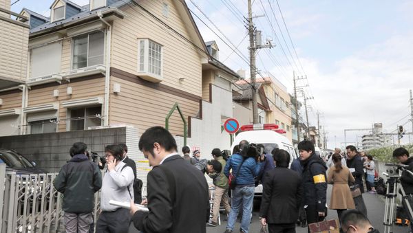Members of the media gather in front of an apartment building where media reported nine bodies were found in Zama, Kanagawa Prefecture, Japan in this photo taken by Kyodo on October 31, 2017 Members of the media gather in front of an apartment building where media reported nine bodies were found in Zama, Kanagawa Prefecture, Japan in this photo taken by Kyodo on October 31, 2017 - Sputnik International