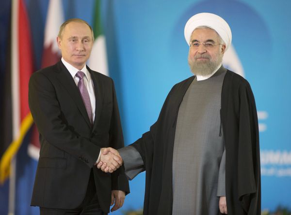 November 23, 2015. Russian President Vladimir Putin, left, and President of the Islamic Republic of Iran Hassan Rouhani meet prior to the summit of the heads of state and government of the Gas Exporting Countries Forum in Tehran. (File) - Sputnik International
