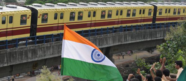 (File) Indian school students wave to greet a Kolkata Metro coach during its inaugural run in Kolkata on August 22, 2009 - Sputnik International