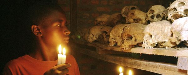 FILE - In this April 6, 2004 file photo, Apollan Odetta, a survivor from the 1994 Rwandan Genocide light candles at a mass grave in Nyamata, Rwanda FILE - In this April 6, 2004 file photo, Apollan Odetta, a survivor from the 1994 Rwandan Genocide light candles at a mass grave in Nyamata, Rwanda - Sputnik International