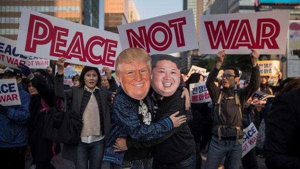 Demostrators dressed as North Korean leader Kim Jong-Un (R) and US President Donald Trump (L) embrace during a peace rally in Seoul on November 5, 2017 Demostrators dressed as North Korean leader Kim Jong-Un (R) and US President Donald Trump (L) embrace during a peace rally in Seoul on November 5, 2017 - Sputnik International