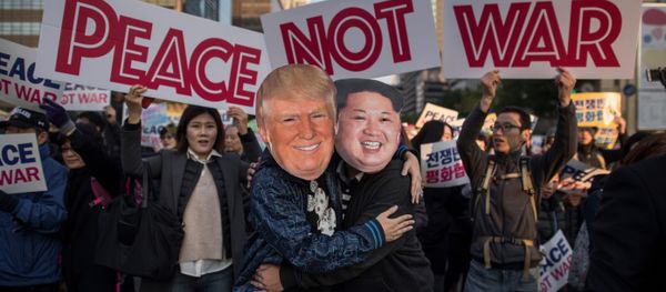 Demostrators dressed as North Korean leader Kim Jong-Un (R) and US President Donald Trump (L) embrace during a peace rally in Seoul on November 5, 2017 Demostrators dressed as North Korean leader Kim Jong-Un (R) and US President Donald Trump (L) embrace during a peace rally in Seoul on November 5, 2017 - Sputnik International