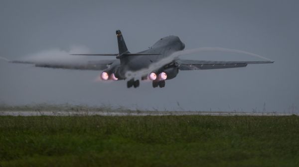 U.S. Air Force B-1B Lancer bomber assigned to 37th Expeditionary Bomb Squadron, deployed from Ellsworth Air Force Base, South Dakota, takes off from Andersen Air Force Base, Guam, to fly a mission with two Koku Jieitai (Japan Air Self-Defense Force) F-15s, Sept. 9, 2017 - Sputnik International
