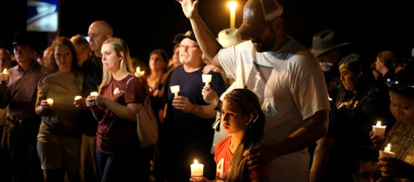 Ramiro and Sofia Martinez attend a candle light vigil after a mass shooting at the First Baptist Church in Sutherland Springs, Texas, U.S., November 5, 2017 - Sputnik International