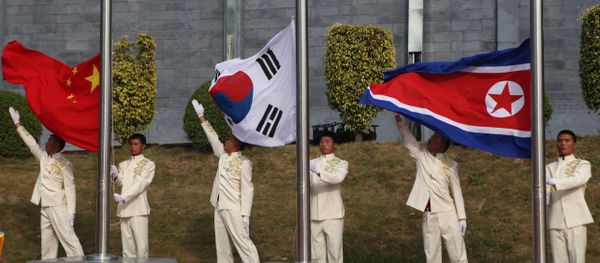 The flags of South Korea (C), China (L) and North Korea (File) The flags of South Korea (C), China (L) and North Korea (File) - Sputnik International