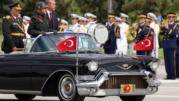 Turkish President Recep Tayyip Erdogan, right, and Chief of Staff Gen. Necdet Ozel, left, inspect the military on Victory Day in Ankara, Turkey, Saturday, Aug. 30, 2014. - Sputnik International