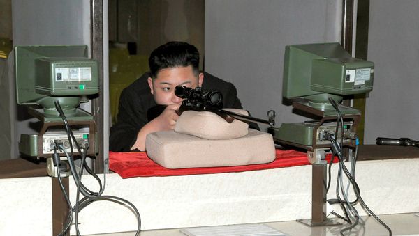 North Korean leader Kim Jong-Un aims a rifle at the Sporting Bullet Factory (File) - Sputnik International