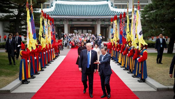 U.S. President Donald Trump walks with South Korea's President Moon Jae-in during a welcoming ceremony at the Presidential Blue House in Seoul, South Korea, November 7, 2017 U.S. President Donald Trump walks with South Korea's President Moon Jae-in during a welcoming ceremony at the Presidential Blue House in Seoul, South Korea, November 7, 2017 - Sputnik International