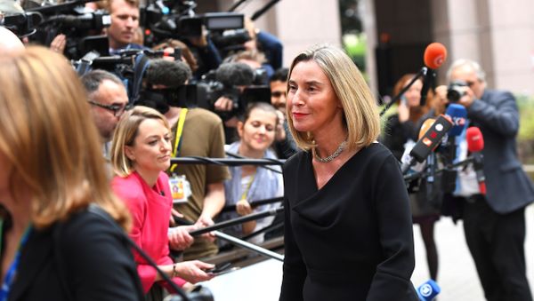 EU's High representative for foreign affairs and security policy Federica Mogherini (R) waves as she arrives in Brussels, on October 19, 2017 - Sputnik International