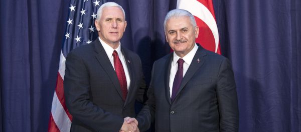 United States Vice President Mike Pence, left and Turkey's Prime Minister Binali Yildirim, right, shake hands for the photographers prior to their meeting during the Munich Security Conference in Munich, Germany United States Vice President Mike Pence, left and Turkey's Prime Minister Binali Yildirim, right, shake hands for the photographers prior to their meeting during the Munich Security Conference in Munich, Germany - Sputnik International