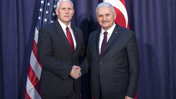 United States Vice President Mike Pence, left and Turkey's Prime Minister Binali Yildirim, right, shake hands for the photographers prior to their meeting during the Munich Security Conference in Munich, Germany United States Vice President Mike Pence, left and Turkey's Prime Minister Binali Yildirim, right, shake hands for the photographers prior to their meeting during the Munich Security Conference in Munich, Germany - Sputnik International