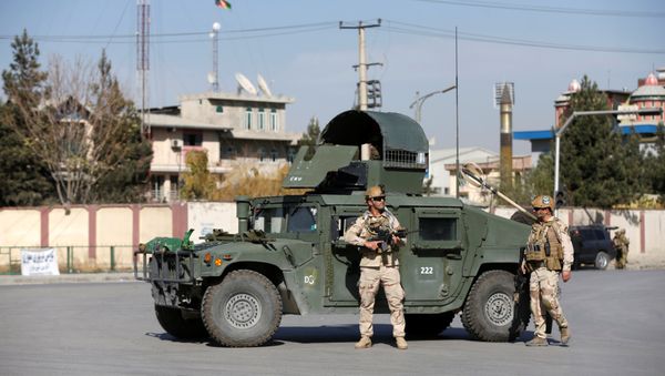 Afghan security forces keep watch at the site of an attack in Kabul, Afghanistan - Sputnik International