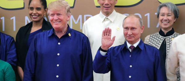Russian President Vladimir Putin and US President Donald Trump, left, front, taking part in the traditional ceremony of taking photos in national Vietnamese clothes during APEC Economic Leaders’ Meeting in Vietnam Russian President Vladimir Putin and US President Donald Trump, left, front, taking part in the traditional ceremony of taking photos in national Vietnamese clothes during APEC Economic Leaders’ Meeting in Vietnam - Sputnik International
