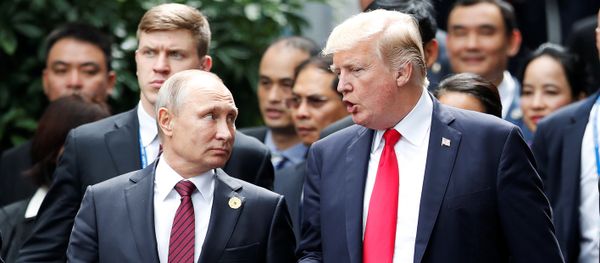 U.S. President Donald Trump and Russia's President Vladimir Putin talk as Vietnam's President Tran Dai Quang (R) looks on, during the family photo session at the APEC Summit in Danang, Vietnam November 11, 2017 U.S. President Donald Trump and Russia's President Vladimir Putin talk as Vietnam's President Tran Dai Quang (R) looks on, during the family photo session at the APEC Summit in Danang, Vietnam November 11, 2017 - Sputnik International