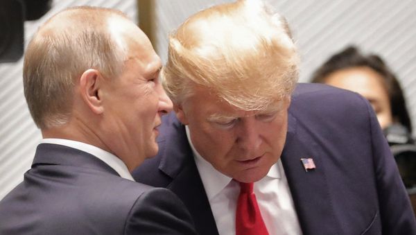 Russian President Vladimir Putin and US President Donald Trump, right, are seen here ahead of the first working meeting of the Asia-Pacific Economic Cooperation leaders - Sputnik International