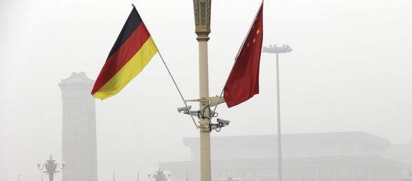 German and Chinese national flags are attached to a lamp post on Tiananmen Square (File) German and Chinese national flags are attached to a lamp post on Tiananmen Square (File) - Sputnik International