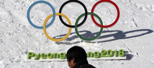 In this Feb. 3, 2017 photo, a man walks by the Olympic rings with a sign of 2018 Pyeongchang Olympic and Paralympic Winter Games in Pyeongchang, South Korea In this Feb. 3, 2017 photo, a man walks by the Olympic rings with a sign of 2018 Pyeongchang Olympic and Paralympic Winter Games in Pyeongchang, South Korea - Sputnik International