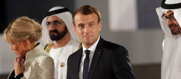 French President Emmanuel Macron gestures as he is welcomed by Abu Dhabi Crown Prince Sheikh Mohammed bin Zayed al-Nahyan and Prime Minister and Vice-President of UAE and Ruler of Dubai Sheikh Mohammed bin Rashid al-Maktoum upon Macron's arrival with his wife at the Louvre Abu Dhabi, in Abu Dhabi, UAE, November 8, 2017 - Sputnik International