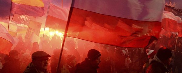 Demonstrators burn flares and wave Polish flags during the annual march to commemorate Poland's National Independence Day in Warsaw, Saturday, Nov. 11, 2017. Thousands of nationalists marched in Warsaw on Poland's Independence Day holiday, taking part in an event that was organized by far-right groups Demonstrators burn flares and wave Polish flags during the annual march to commemorate Poland's National Independence Day in Warsaw, Saturday, Nov. 11, 2017. Thousands of nationalists marched in Warsaw on Poland's Independence Day holiday, taking part in an event that was organized by far-right groups - Sputnik International