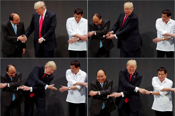 In a combination photo, U.S. President Donald Trump registers his surprise as he realizes other leaders, including Vietnam's Prime Minister Nguyen Xuan Phuc and President of the Philippines Rodrigo Duterte, are crossing their arms for the traditional ASEAN handshake as he participates in the opening ceremony of the ASEAN Summit in Manila, Philippines November 13, 2017 In a combination photo, U.S. President Donald Trump registers his surprise as he realizes other leaders, including Vietnam's Prime Minister Nguyen Xuan Phuc and President of the Philippines Rodrigo Duterte, are crossing their arms for the traditional ASEAN handshake as he participates in the opening ceremony of the ASEAN Summit in Manila, Philippines November 13, 2017 - Sputnik International