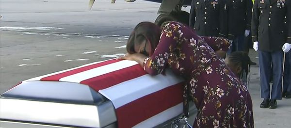 Myeshia Johnson cries over the casket of her husband, Sgt. La David Johnson, who was killed in an ambush in Niger, upon his body's arrival in Miami Myeshia Johnson cries over the casket of her husband, Sgt. La David Johnson, who was killed in an ambush in Niger, upon his body's arrival in Miami - Sputnik International