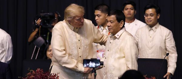 U.S. President Donald Trump shakes hands with Philippines President Rodrigo Duterte during the gala dinner marking ASEAN's 50th anniversary in Manila, Philippines November 12, 2017 U.S. President Donald Trump shakes hands with Philippines President Rodrigo Duterte during the gala dinner marking ASEAN's 50th anniversary in Manila, Philippines November 12, 2017 - Sputnik International