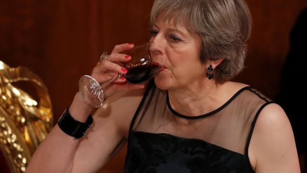 Britain's Prime Minister Theresa May drinks a toast at the Lord Mayor's Banquet at the Guildhall, in London, Britain Britain's Prime Minister Theresa May drinks a toast at the Lord Mayor's Banquet at the Guildhall, in London, Britain - Sputnik International