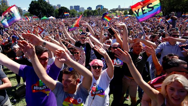 Supporters of the 'Yes' vote for marriage equality celebrate after it was announced the majority of Australians support same-sex marriage in a national survey, paving the way for legislation to make the country the 26th nation to formalise the unions by the end of the year, at a rally in central Sydney, Australia, November 15, 2017 Supporters of the 'Yes' vote for marriage equality celebrate after it was announced the majority of Australians support same-sex marriage in a national survey, paving the way for legislation to make the country the 26th nation to formalise the unions by the end of the year, at a rally in central Sydney, Australia, November 15, 2017 - Sputnik International