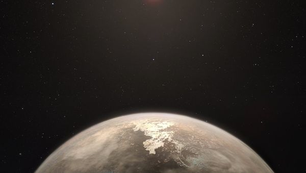 This artist’s impression shows the temperate planet Ross 128 b, with its red dwarf parent star in the background. - Sputnik International