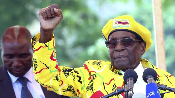 In this Nov. 8, 2017, file photo, Zimbabwe's President Robert Mugabe, left, and his wife Grace Mugabe chant the party's slogan during a solidarity rally in Harare, Zimbabwe. - Sputnik International
