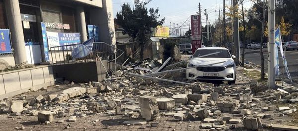 Debris from a collapsed wall is scattered in front of a shop after an earthquake in Pohang, South Korea Debris from a collapsed wall is scattered in front of a shop after an earthquake in Pohang, South Korea - Sputnik International