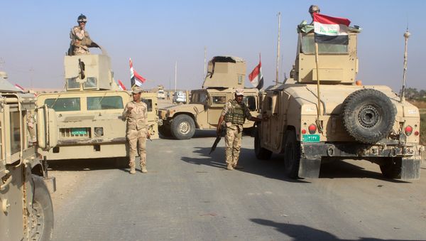 Iraqi security forces gather in the Rawa area during an operation to retake the Euphrates Valley town from the Islamic State group on November 11, 2017 Iraqi security forces gather in the Rawa area during an operation to retake the Euphrates Valley town from the Islamic State group on November 11, 2017 - Sputnik International
